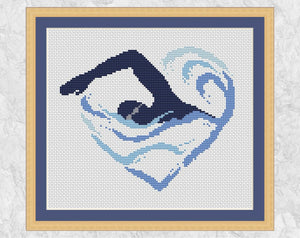 Cross stitch picture of a swimmer, with their arm and a wave making the shape of a heart