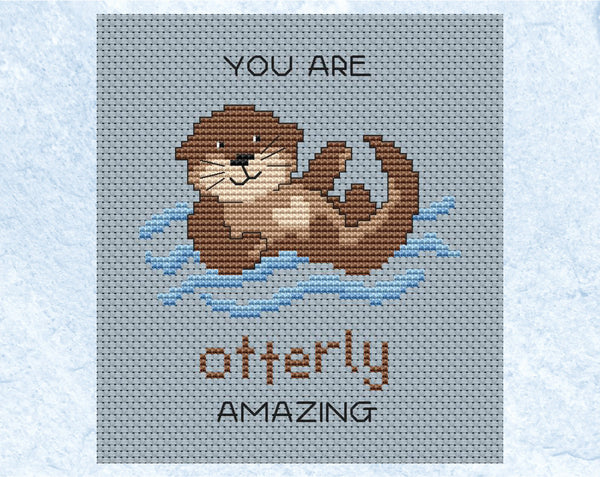 Otterly Amazing cross stitch pattern. Cartoon of an otter with the words "You are otterly amazing". Shown without frame.