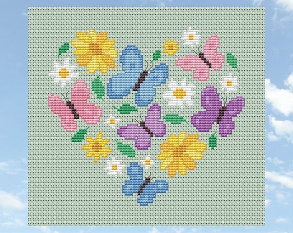 Butterfly Heart cross stitch pattern. Butterflies in pink, purple and blue pastel colours, daisies, yellow flowers and leaves form a heart shape. Shown without frame.