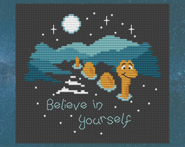 'Believe in Yourself' cross stitch pattern. Nessie the Loch Ness monster in the dark loch with the words 'Believe in yourself'. Shown without frame.