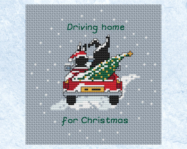 Driving Home for Christmas cross stitch pattern - the two Together Bunnies in a car with a Christmas tree in the back. Shown without frame.