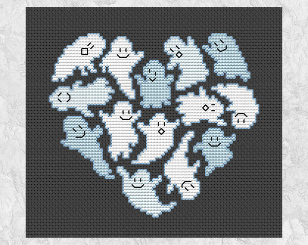 Ghostly Heart Halloween cross stitch pattern. Heart shape made out of fun ghosts. Shown without frame.