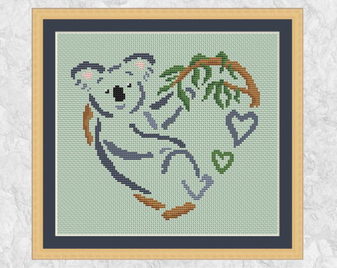 Koala Heart cross stitch pattern. Shown with frame.