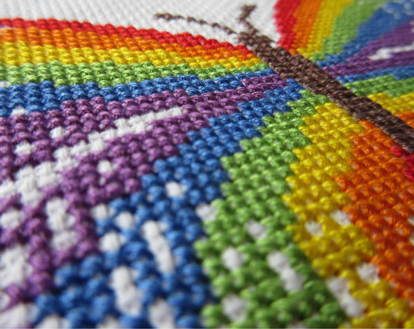 Rainbow Butterfly cross stitch pattern - close up angled view of stitched piece