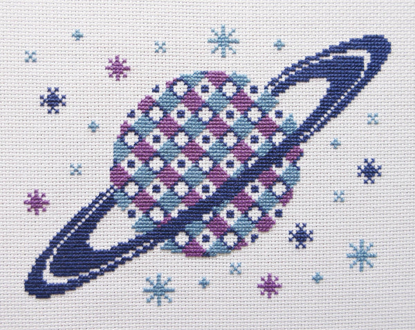Patterned Saturn cross stitch kit - stitched piece of the geometric planet.