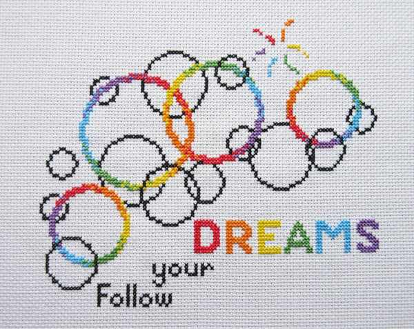 Cross stitch pattern of rainbow bubbles with the words Follow your DREAMS - photo without backdrop