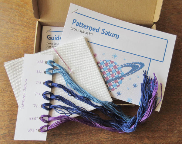 Patterned Saturn cross stitch kit - box contents
