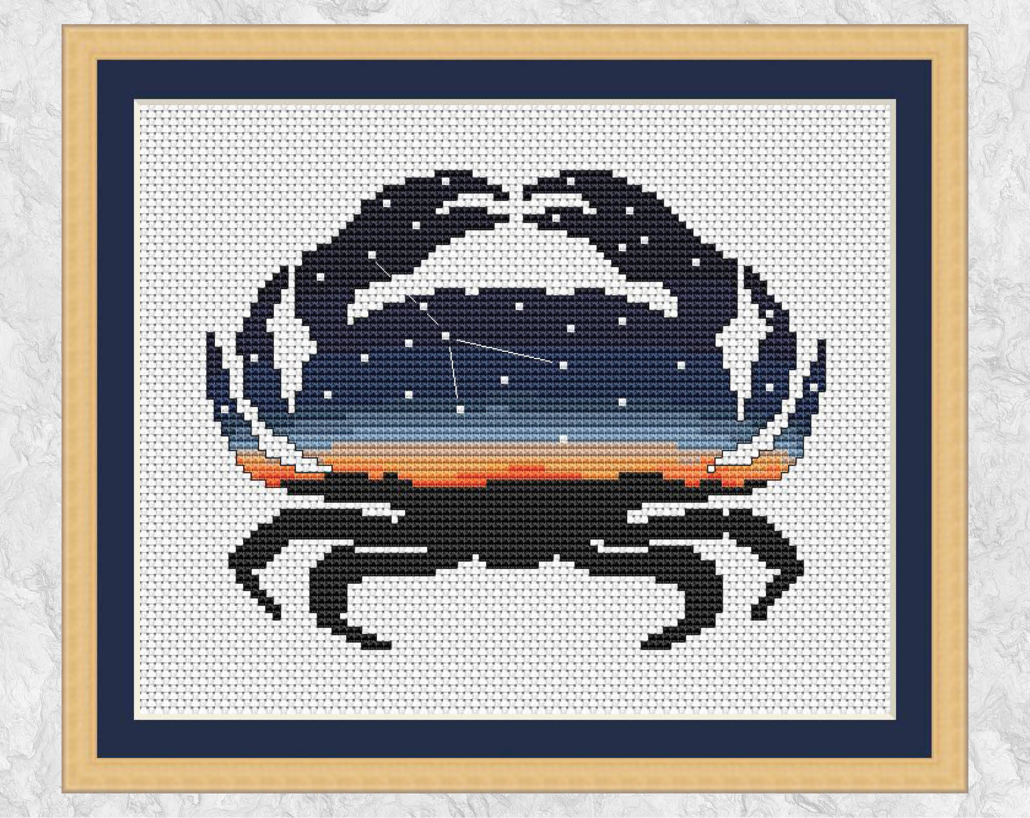 Cross stitch pattern of a crab silhouette filled with the zodiac constellation of Cancer against an evening sky. With frame.