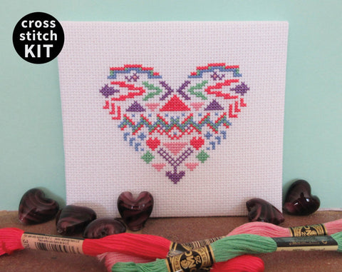 Aztec Heart cross stitch kit - picture of finished stitched heart piece with props