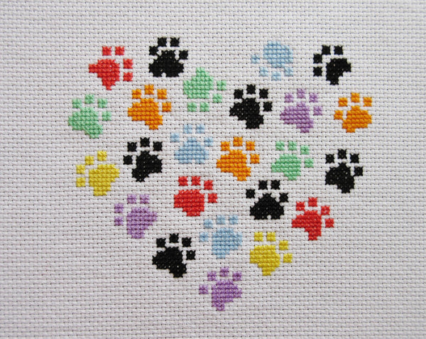 Stitched image of smaller paw print heart cross stitch pattern