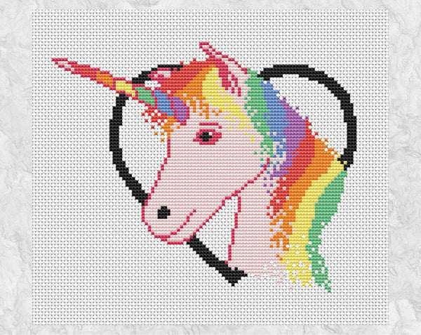 Cross stitch pattern PDF of a rainbow and pink unicorn framed in a heart. Shown without mount