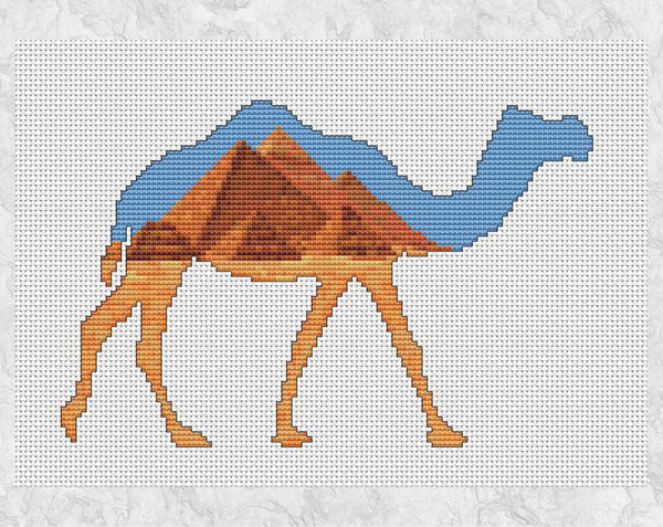 Cross stitch pattern of a camel silhouette filled with a desert scene of the famous Pyramids in Egypt. Shown without frame.