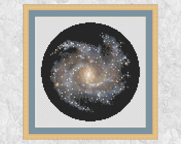 Galaxy NGC 5468 - Astronomy cross stitch pattern - in frame on white fabric