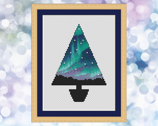 Aurora Christmas Tree cross stitch pattern. Image shows Christmas tree shape filled with aurora and without the silhouette of a photographer.