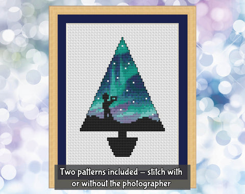 Aurora Christmas Tree cross stitch pattern. Two patterns included - stitch with or without photographer silhouette. Image shows Christmas tree shape filled with aurora and silhouette of a photographer.