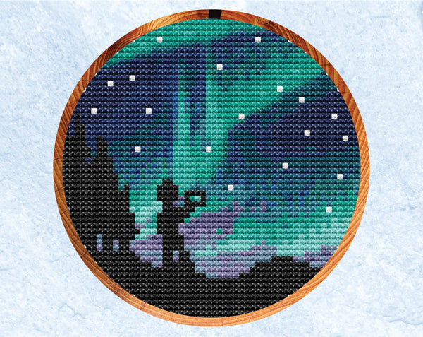 Aurora cross stitch pattern. Version with photographer silhouette.