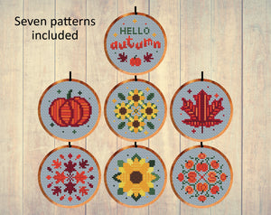 Autumn Minis cross stitch patterns by Climbing Goat Designs. Set of seven patterns in 3 inch hoops. One says 'Hello Autumn'; there are two pumpkin patterns, two sunflower patterns and two leaf patterns.