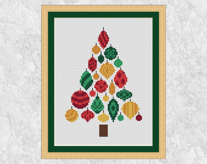 Christmas Tree of Baubles cross stitch pattern. Christmas tree shape made up of patterned baubles in shades of red, green and gold. Shown in frame.