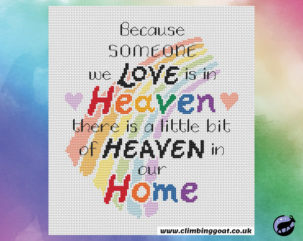 Bereavement cross stitch pattern with the words "Because someone we love is in heaven, there is a little bit of heaven in our home" arranged over a pastel rainbow. Shown without frame.