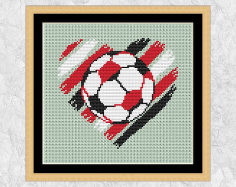 Brushstrokes Football Heart cross stitch pattern. Shown in frame.