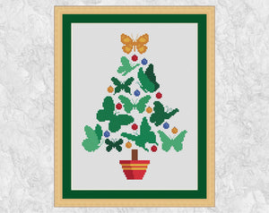 Butterfly Christmas Tree cross stitch patterns. Shown with frame.