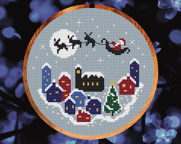 Christmas Village cross stitch pattern. Shown in hoop.