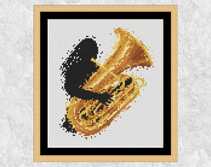 Modern art music cross stitch pattern of a female tuba player. Shown with frame.
