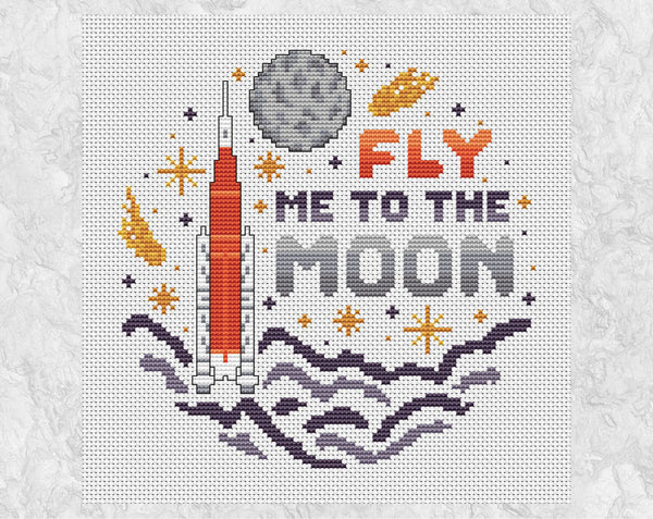 Fly Me To The Moon cross stitch pattern. Cartoon of Artemis rocket, Moon and stars. Shown without frame.