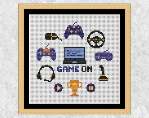 Game On computer games cross stitch pattern. Shown in frame.