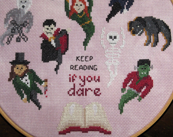Halloween by the Book cross stitch pattern. Close up of lower half of stitched piece.