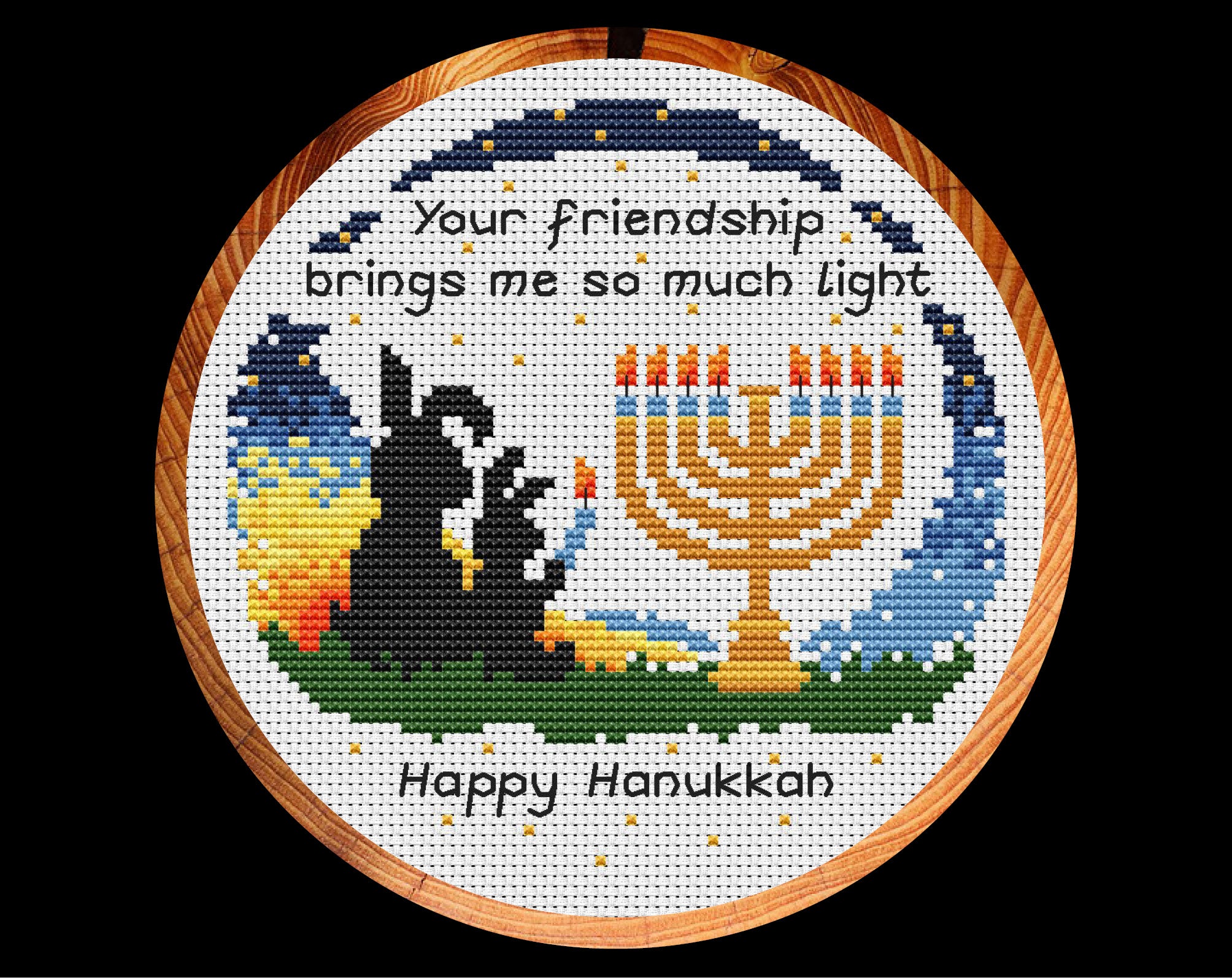 Hanukkah Friendship cross stitch pattern. Bunnies lighting a menorah with the words 'Your friendship brings me so much light - Happy Hanukkah'. Shown in hoop.