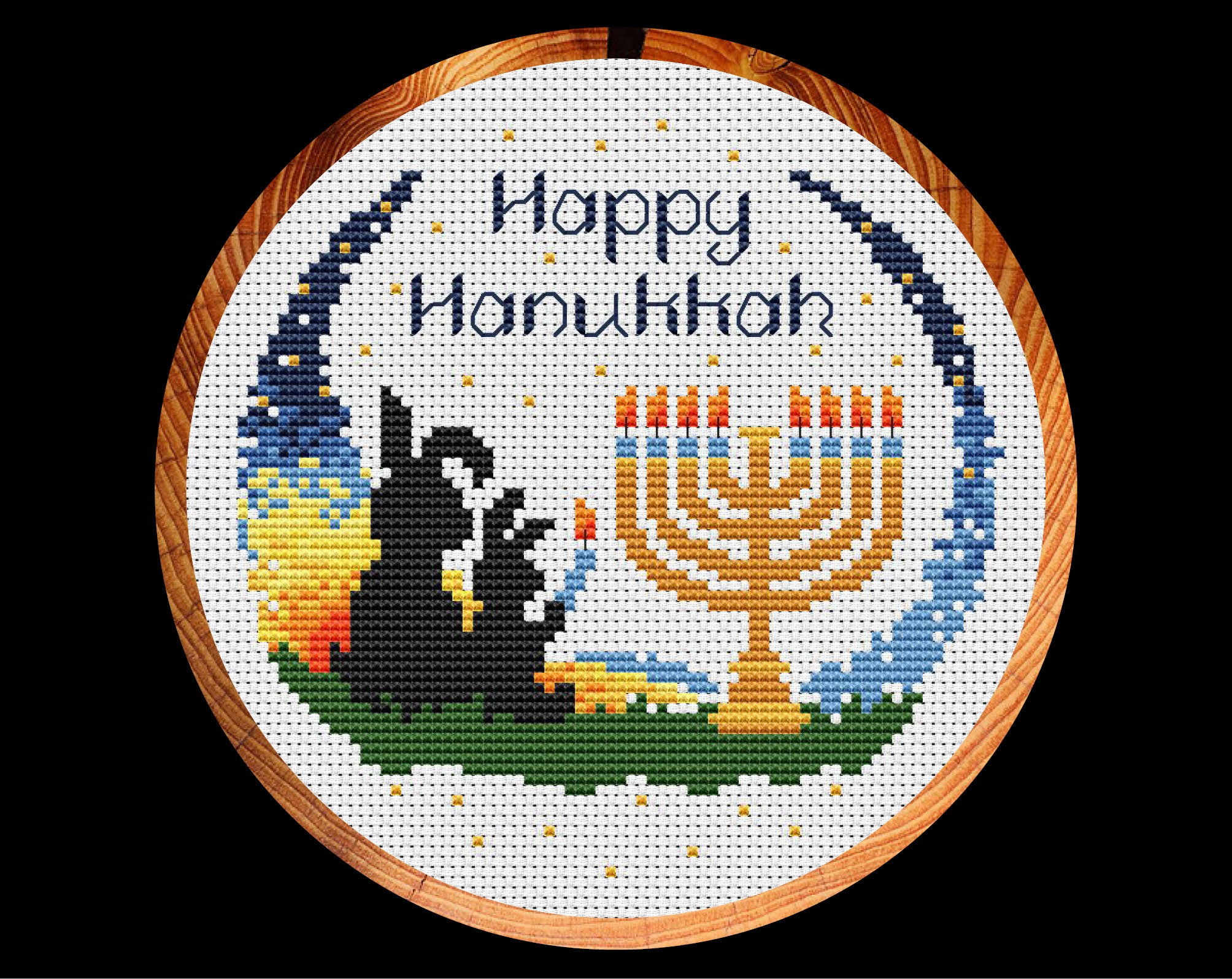 Happy Hanukkah Bunnies cross stitch pattern. Two bunnies lighting a menorah at sunset with the words Happy Hanukkah. Shown in hoop.