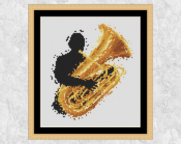 Modern art music cross stitch pattern of a male tuba player. Shown with frame.