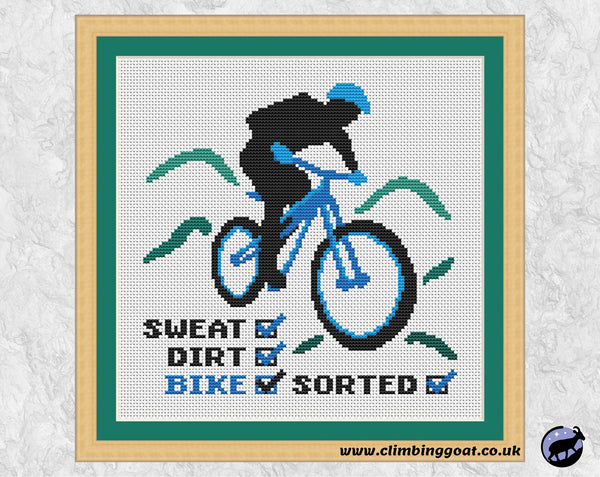 Mountain Bike cross stitch pattern. Silhouette of mountain biker with the words SWEAT DIRT BIKE SORTED. Shown with frame.