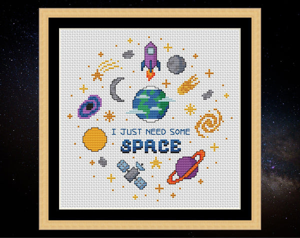 I Just Need Some Space cross sittch pattern. Fun astronomy motifs. Design on white fabric in frame.