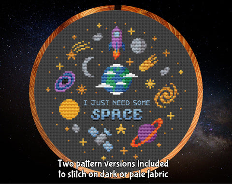 I Just Need Some Space cross stitch pattern. Fun variety of space motifs. Two pattern versions included to stitch on dark or pale fabric. Image shows pattern on black fabric in hoop.