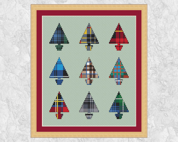 Nine Tartan Christmas Trees cross stitch pattern. Set of nine mini Christmas tree shapes filled with different Scottish tartan patterns. Shown with frame.