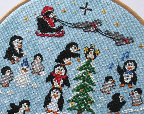 Penguin Christmas cross stitch pattern. Close up of top of pattern.