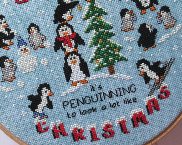 Penguin Christmas cross stitch pattern. Close up of bottom of pattern.