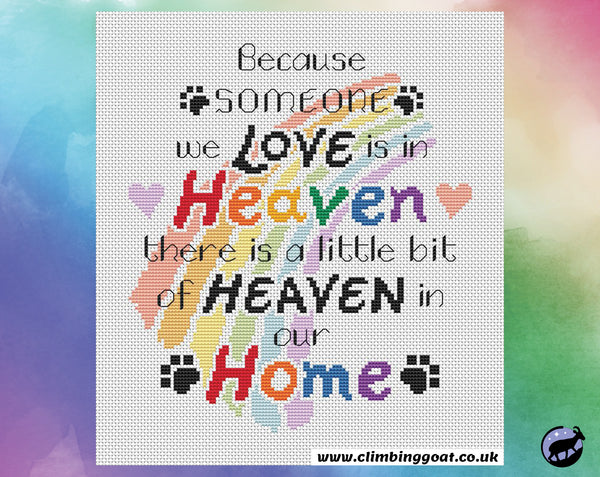 Pet memorial cross stitch pattern with the words "Because someone we love is in heaven, there is a little bit of heaven in our home" arranged over a pastel rainbow. Shown without frame.