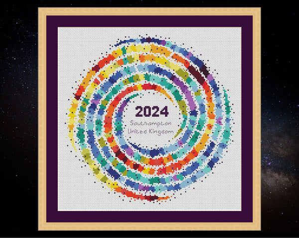 Rainbow Temperature Galaxy cross stitch pattern - example image for Southampton for 2024, shown on white fabric in square frame