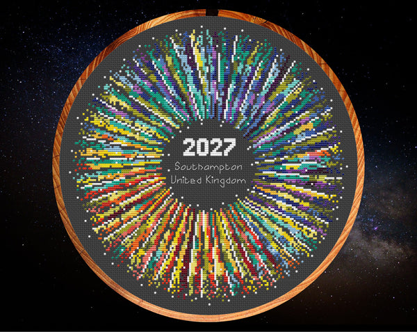 Rainbow Temperature Supernova cross stitch pattern by Climbing Goat Designs - maximum and minimum temperatures version. Shown in hoop on black fabric.