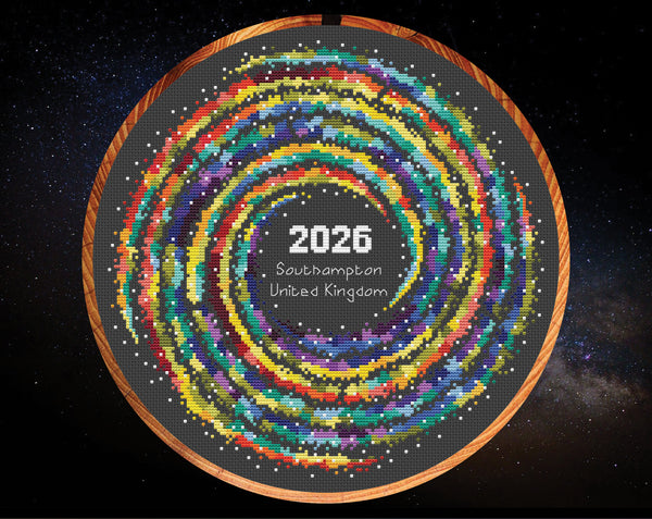 Rainbow Temperature Galaxy cross stitch pattern - example image for Southampton for 2026, shown on black fabric in 11 inch hoop. Maximum and minimum temperatures pattern version.