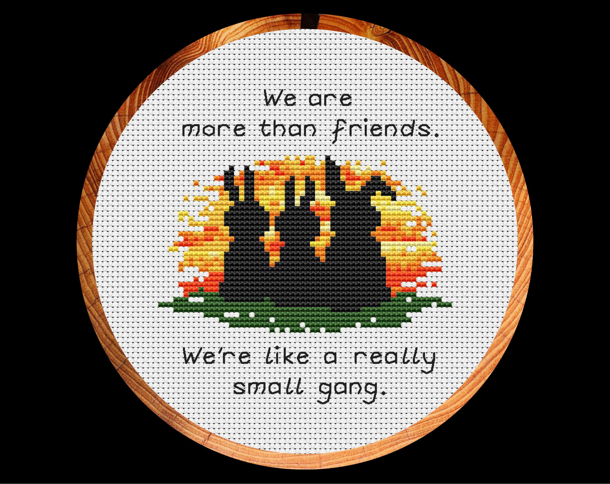 Really Small Gang Friendship cross stitch pattern. Three bunnies watching a sunset with the words 'We are more than friends. We're like a really small gang.' Shown in hoop.