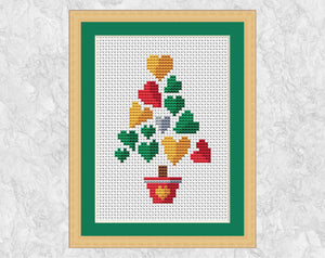 Smaller Hearts Christmas Tree cross stitch pattern. Shown in frame.