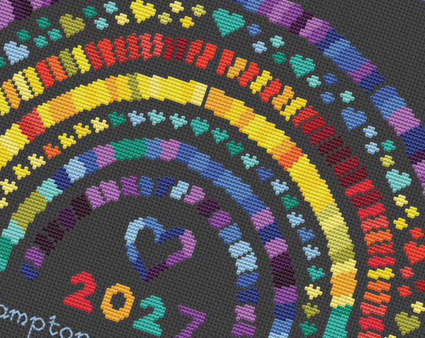 Temperature Rainbow cross stitch pattern by Climbing Goat Designs - maximum temperatures version. Close up of design on black faric.