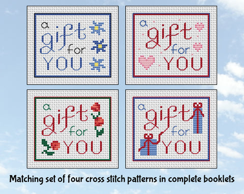 Matching set of four cross stitch patterns all with the text 'a gift for you'. Set 1.