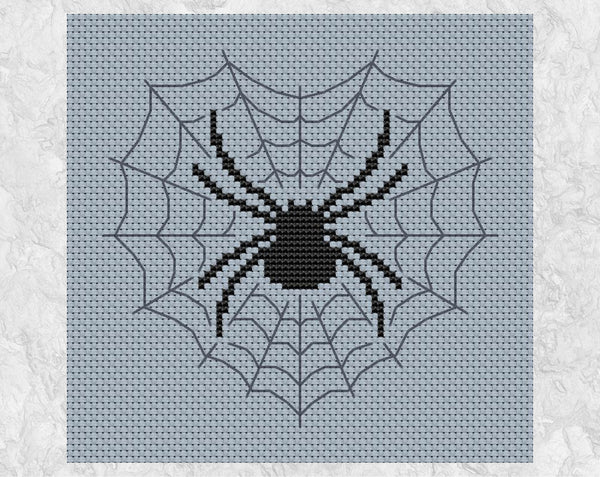 A Spider's Heart cross stitch pattern. A large spider in a heart-shaped web. Shown without frame.
