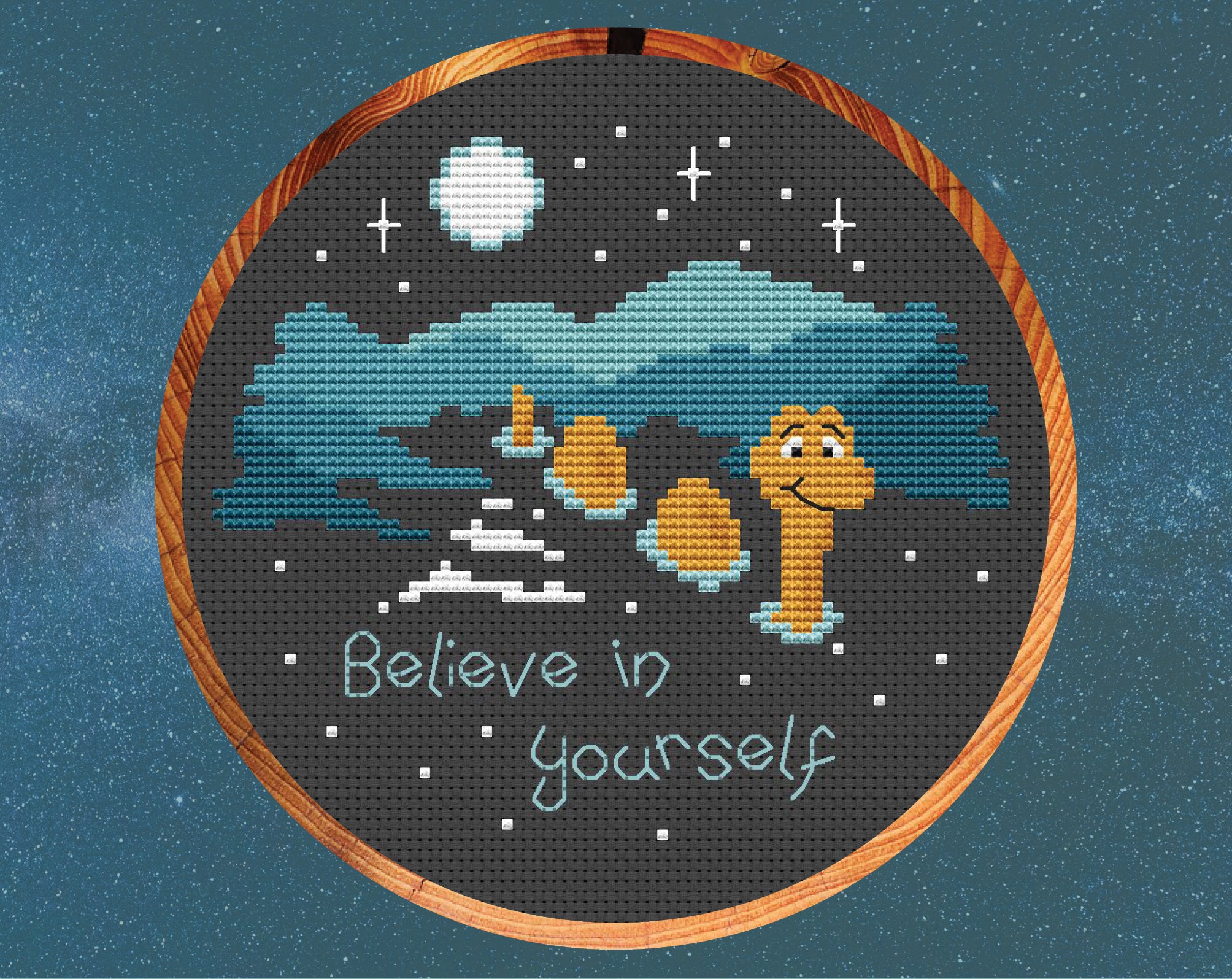 'Believe in Yourself' cross stitch pattern. Nessie the Loch Ness monster in the dark loch with the words 'Believe in yourself'. Shown in hoop.