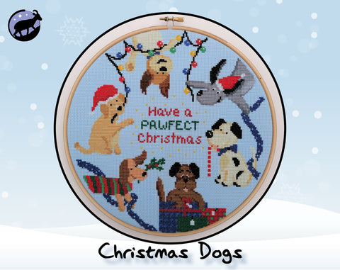 Christmas Dogs cross stitch pattern. Six cartoon dogs in a hoop with the words 'Have a pawfect Christmas'.